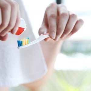 Man brushing teeth in the morning